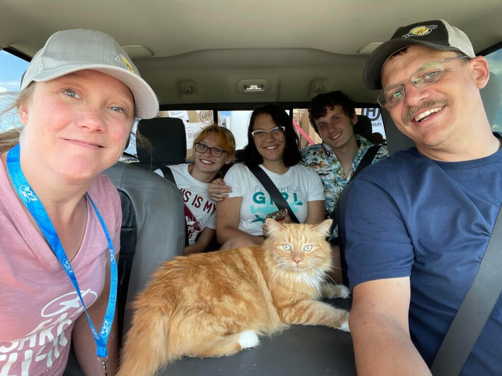 The Scholten family in their camper on vacation with cat Delilah