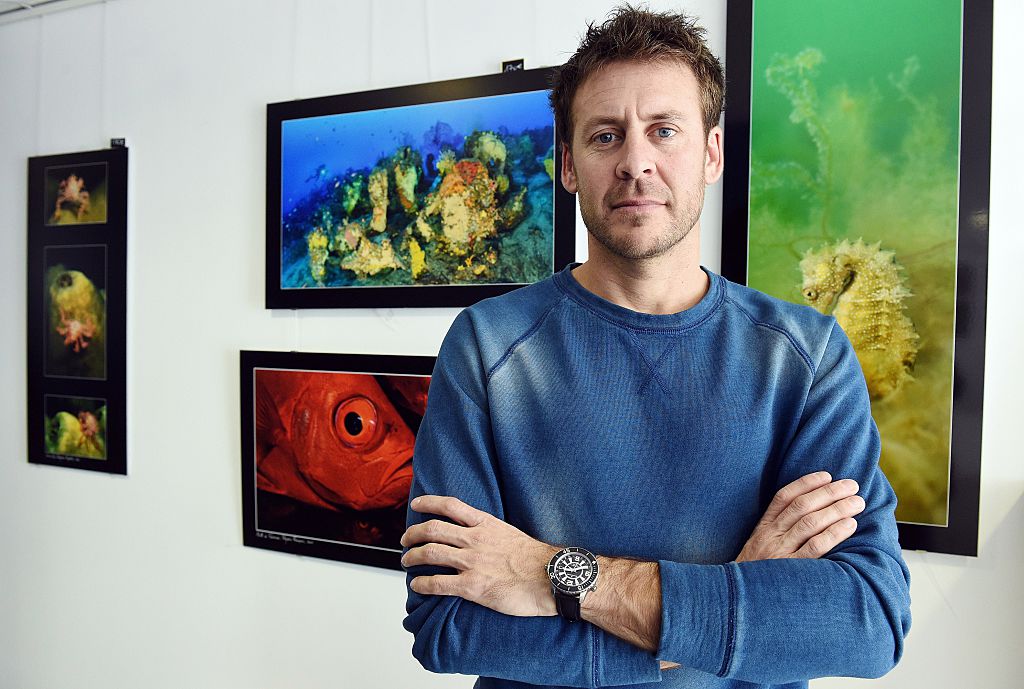 French biologist Laurent Ballesta poses on February 16, 2015 in Carnon, southern France, in front of his underwater pictures.