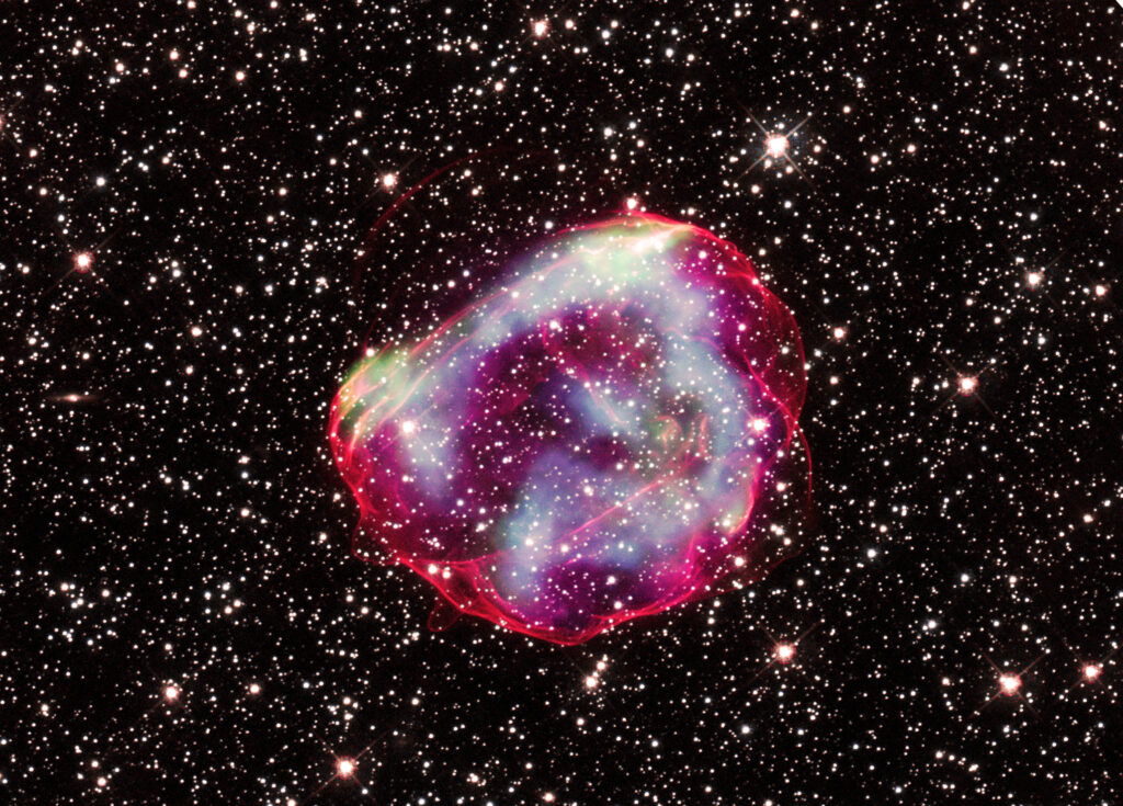 These delicate wisps of gas make up an object known as SNR B0519-69.0, or SNR 0519 for short. The thin, blood-red shells are actually the remnants from when an unstable progenitor star exploded violently as a supernova around 600 years ago.