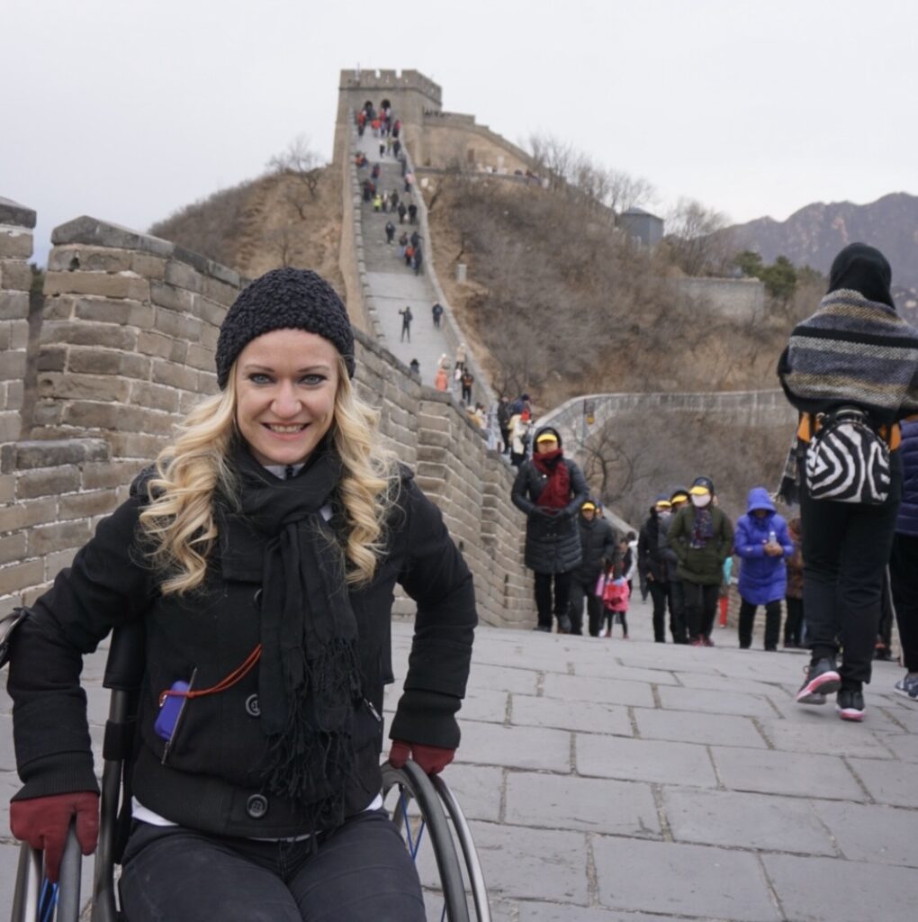 Renee Bruns in front of the steps that lead to the Great Wall of China