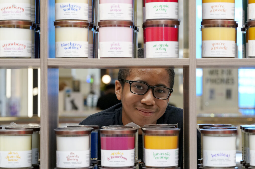 Young entrepreneur Alejandro Buxton, age 12, at Smell of Love Candles on November 1, 2022 in Tysons, Virginia. Buxton started the business in 2019 and operates a kiosk in Tysons Corner Center.