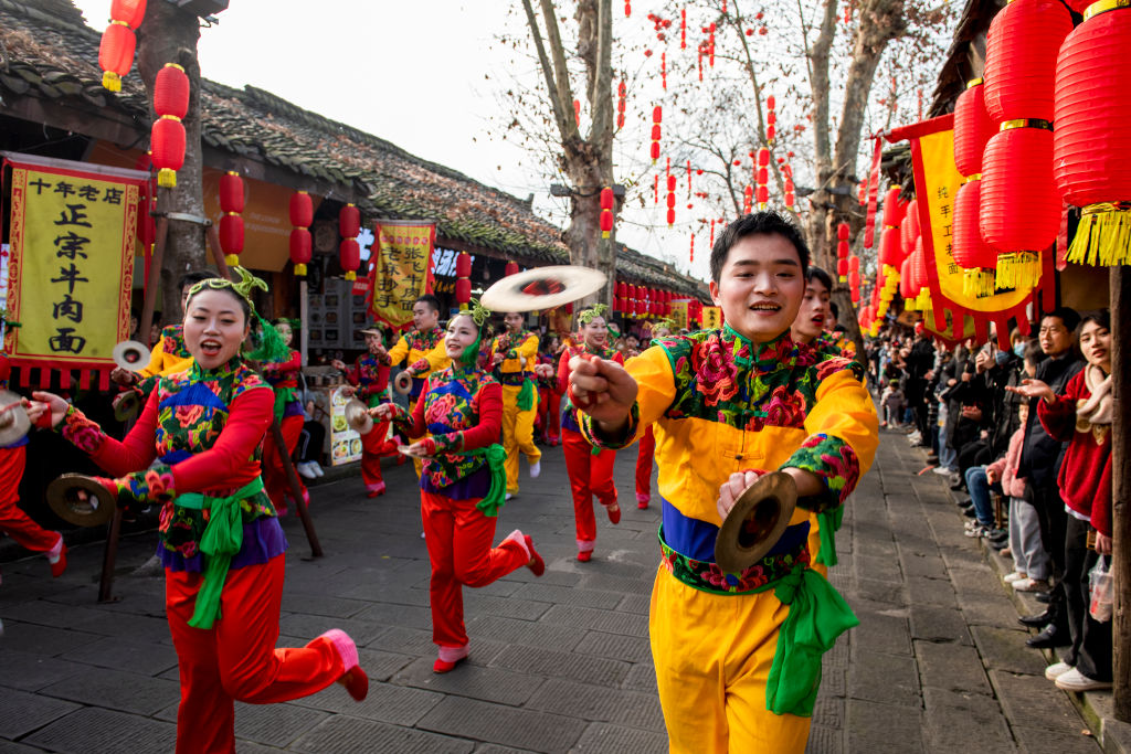 LANGZHONG, CHINA - JANUARY 08: Performers parade at Langzhong Ancient City ahead of Chinese New Year, the year of the Tiger, on January 8, 2022 in Langzhong, Nanchong City, Sichuan Province of China.