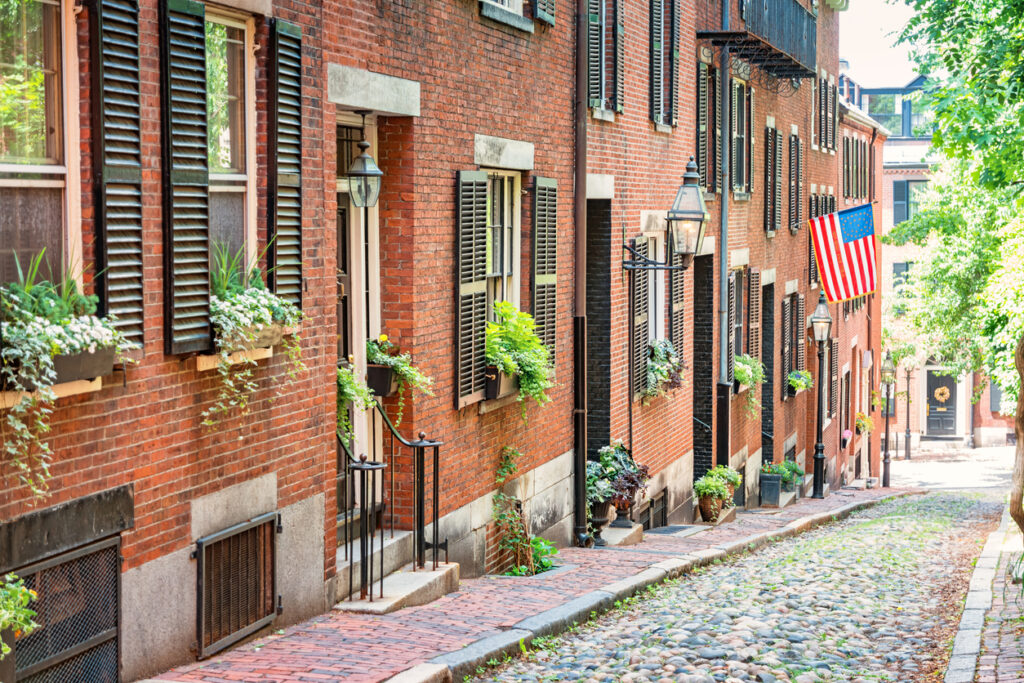 Stock photograph of brownstone townhouses on historic Acorn Street in Beacon Hill, downtown Boston, Massachusetts, USA.