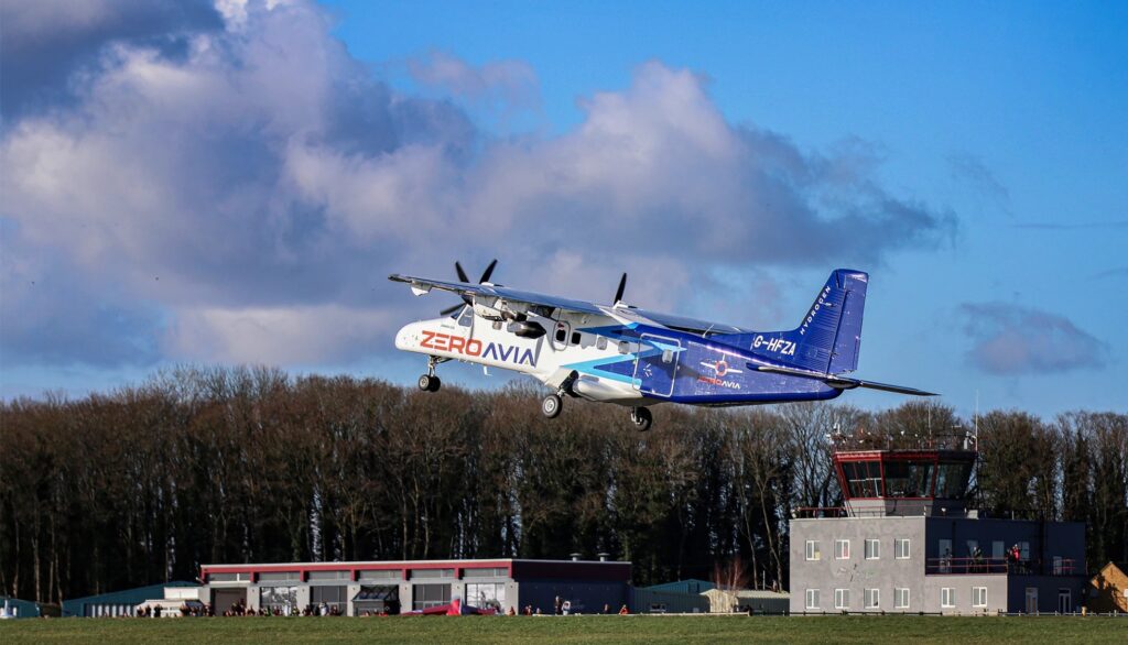 the Zero Avia plane is shown taking off on a clear day with a blue sky