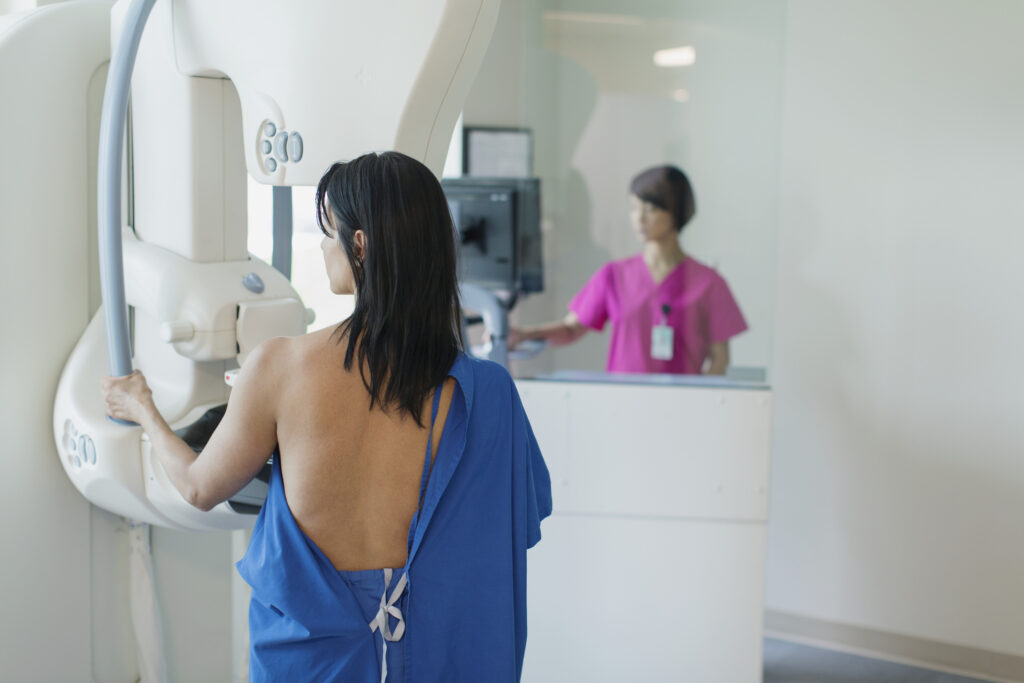 female patient having annual mammogram