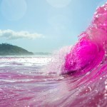 pink waves crashing off coast of San Diego